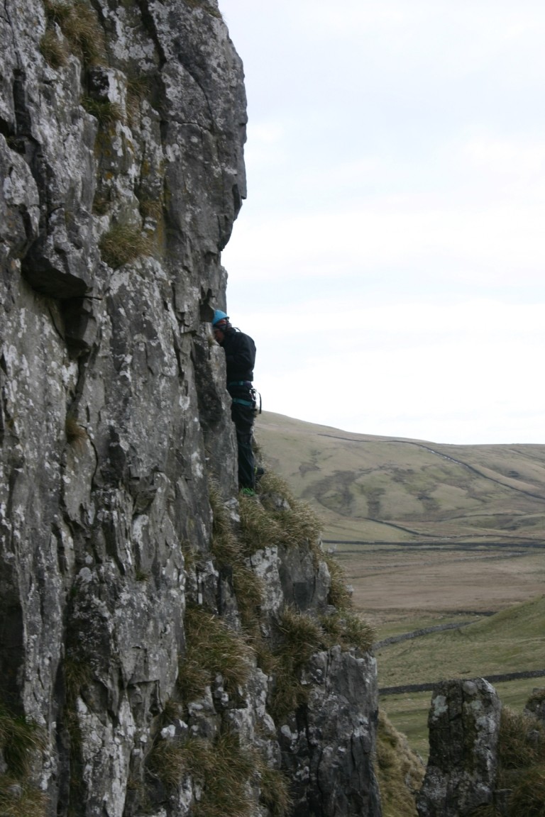 Jane Perched Half Way Up A Scary Cliff Removing Gear, Attermire Scar